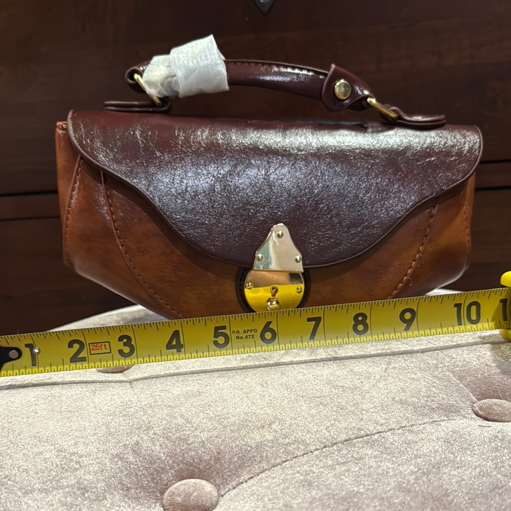 Brown Vegan Leather Clutch with Decorative Clasp and Structured Design - Picture 2 of 9